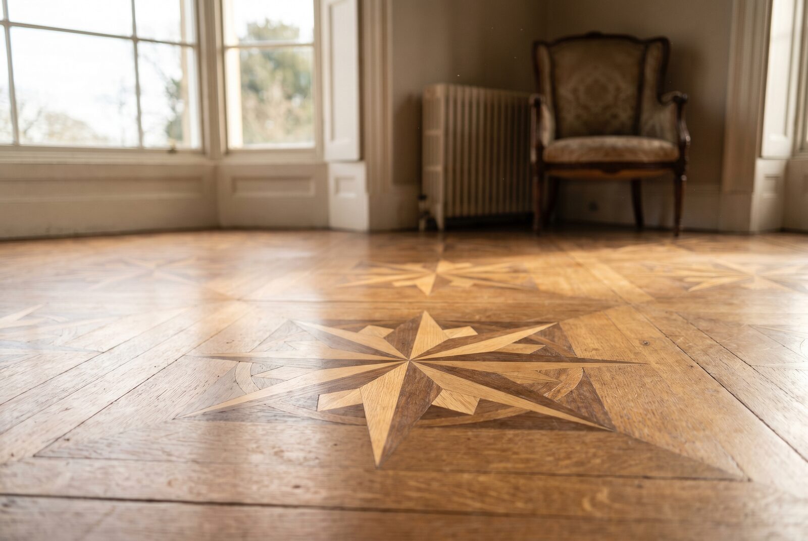 Ornate parquet panel with eight-point star compass marquetry detail