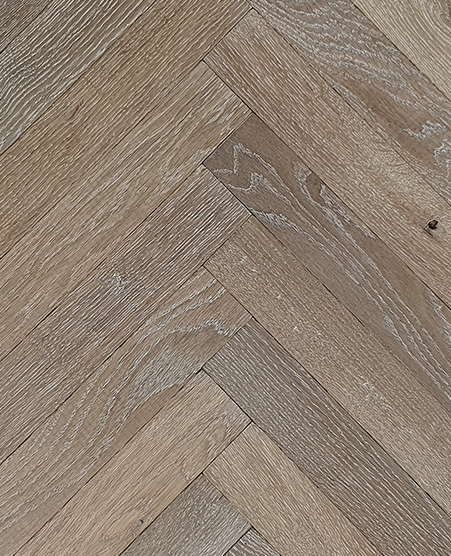Time worn weathered herringbone parquet