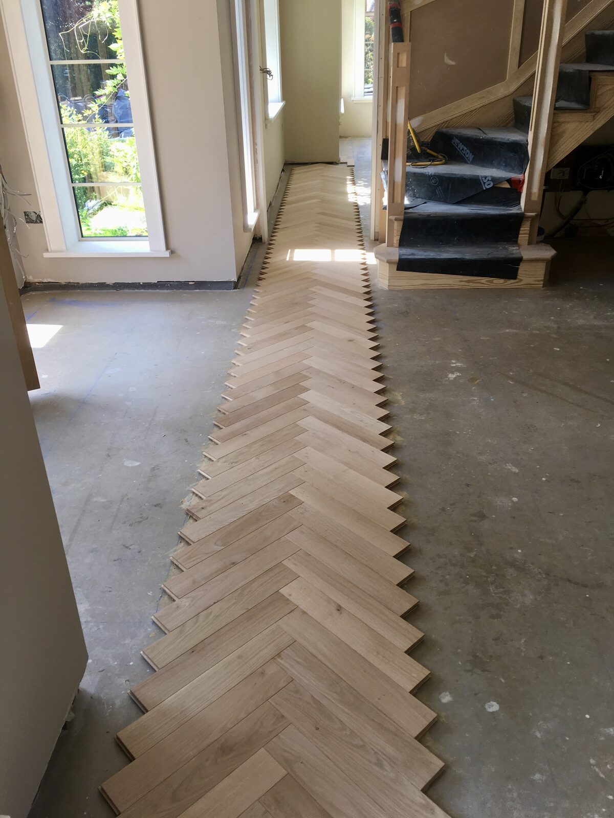 Engineered oak herringbone parquet, of the kind we lay in Chichester homes