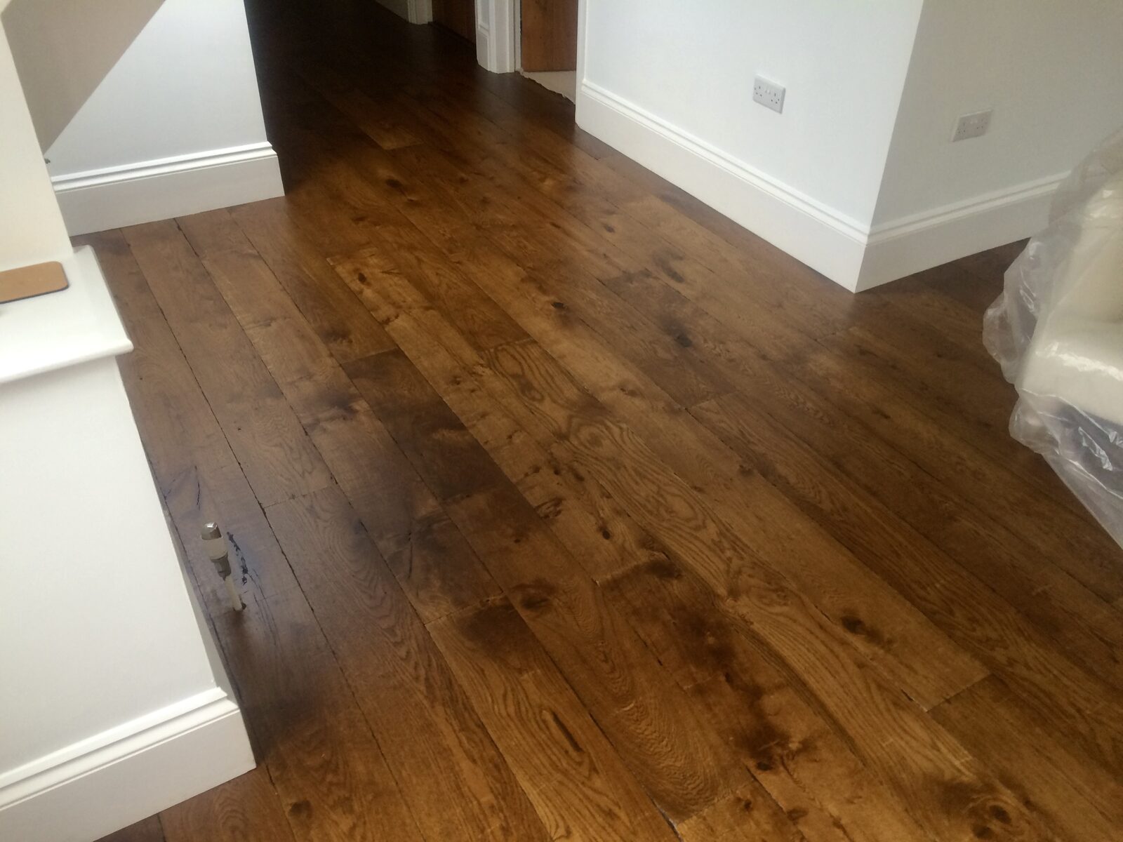 Dark-toned wood flooring, of the kind we lay in Arundel homes