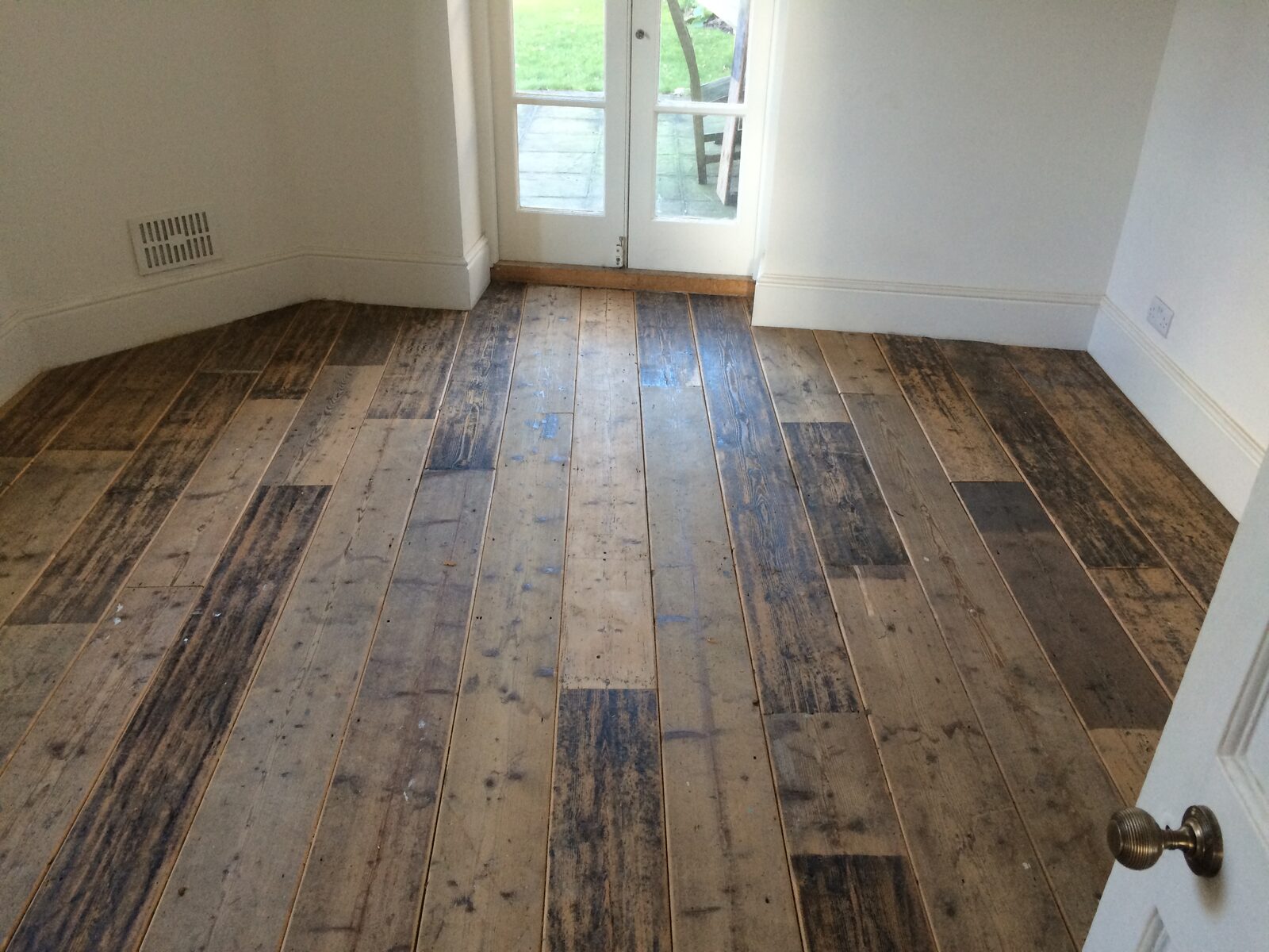 Restored reclaimed pine floorboards laid by Forrestal Flooring