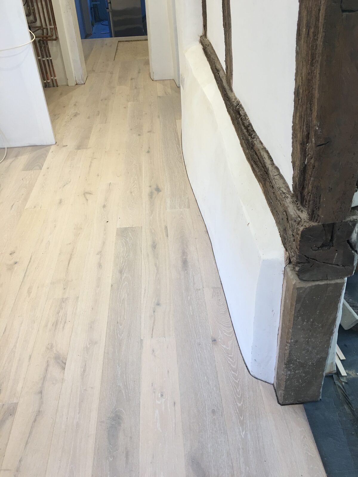 Whitewashed engineered oak plank flooring, of the kind we lay in Emsworth homes