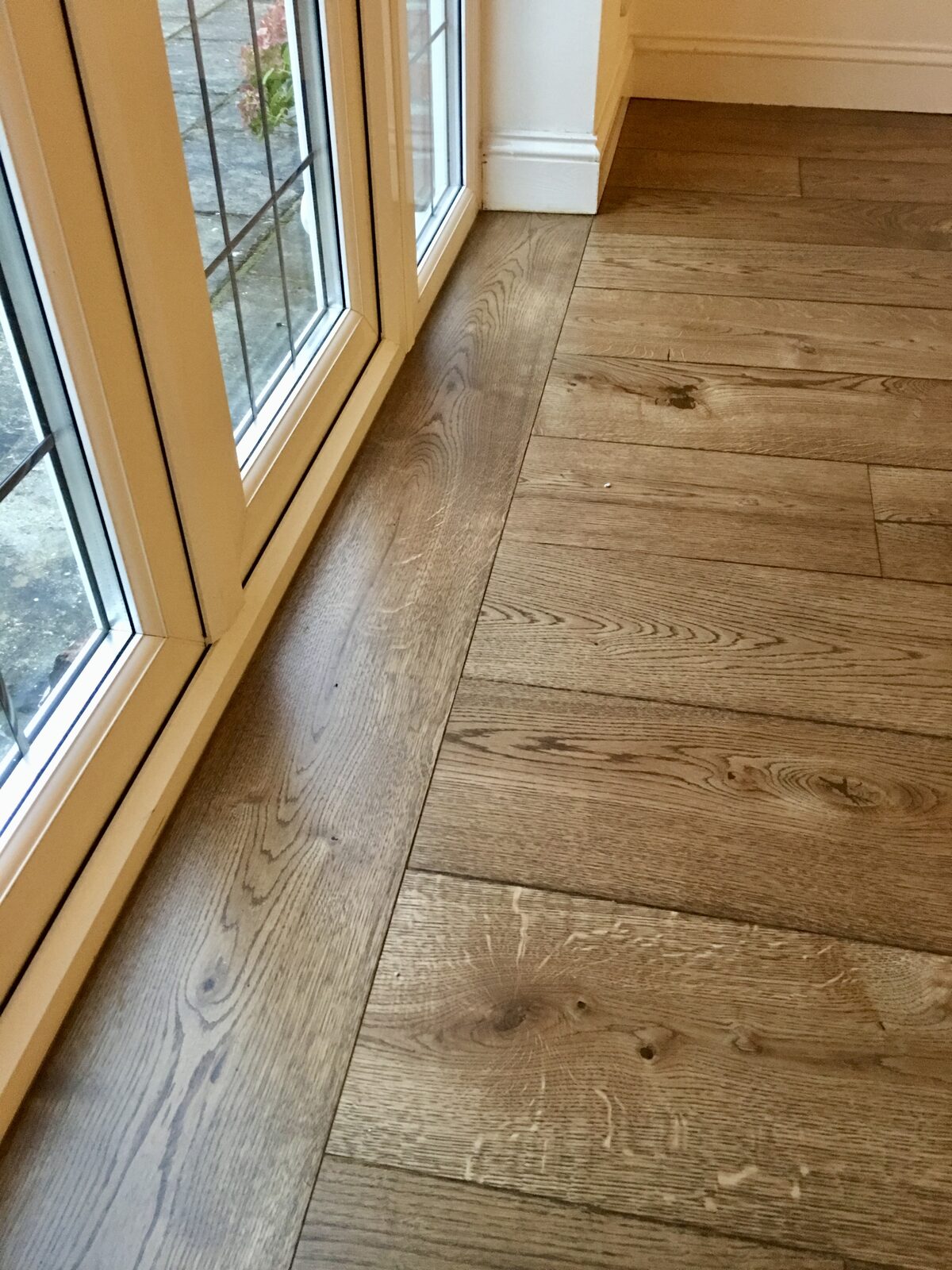Rustic engineered oak plank flooring, of the kind we lay in Goodwood homes