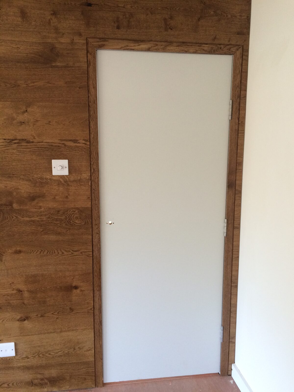 Timber-clad feature wall in a Birdham home