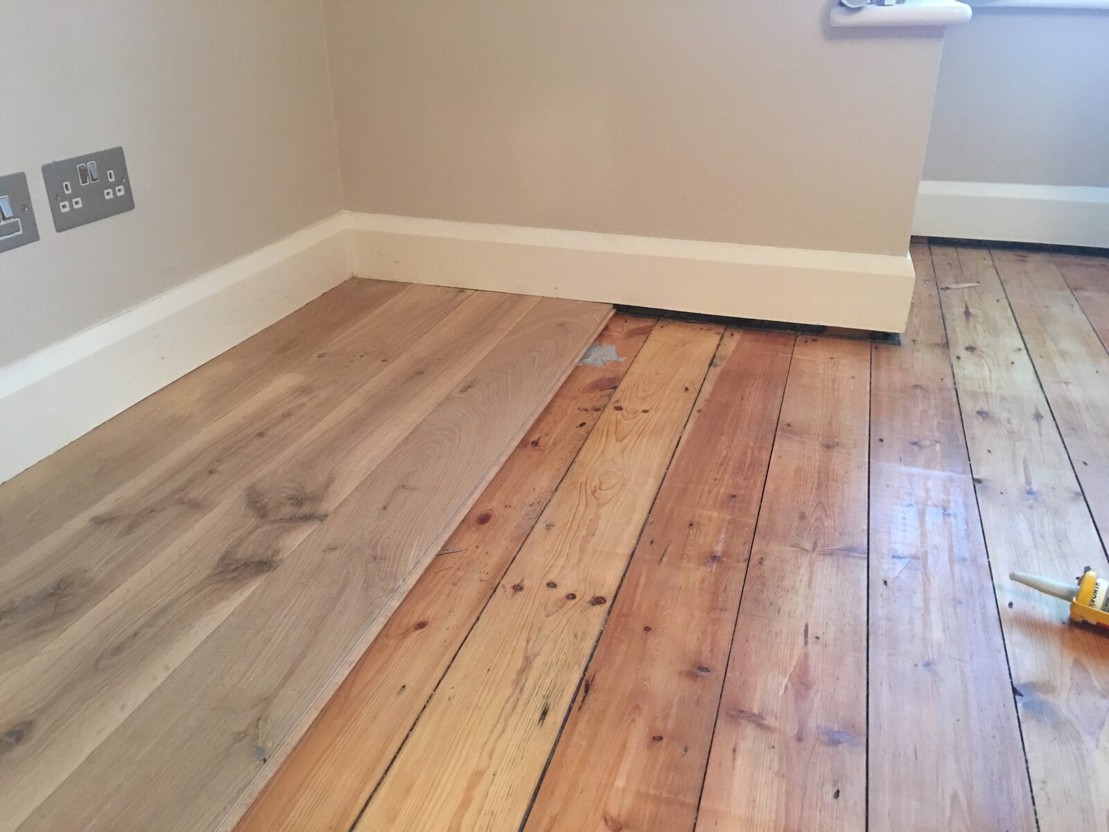 Rustic engineered oak plank flooring in a Dell Quay home