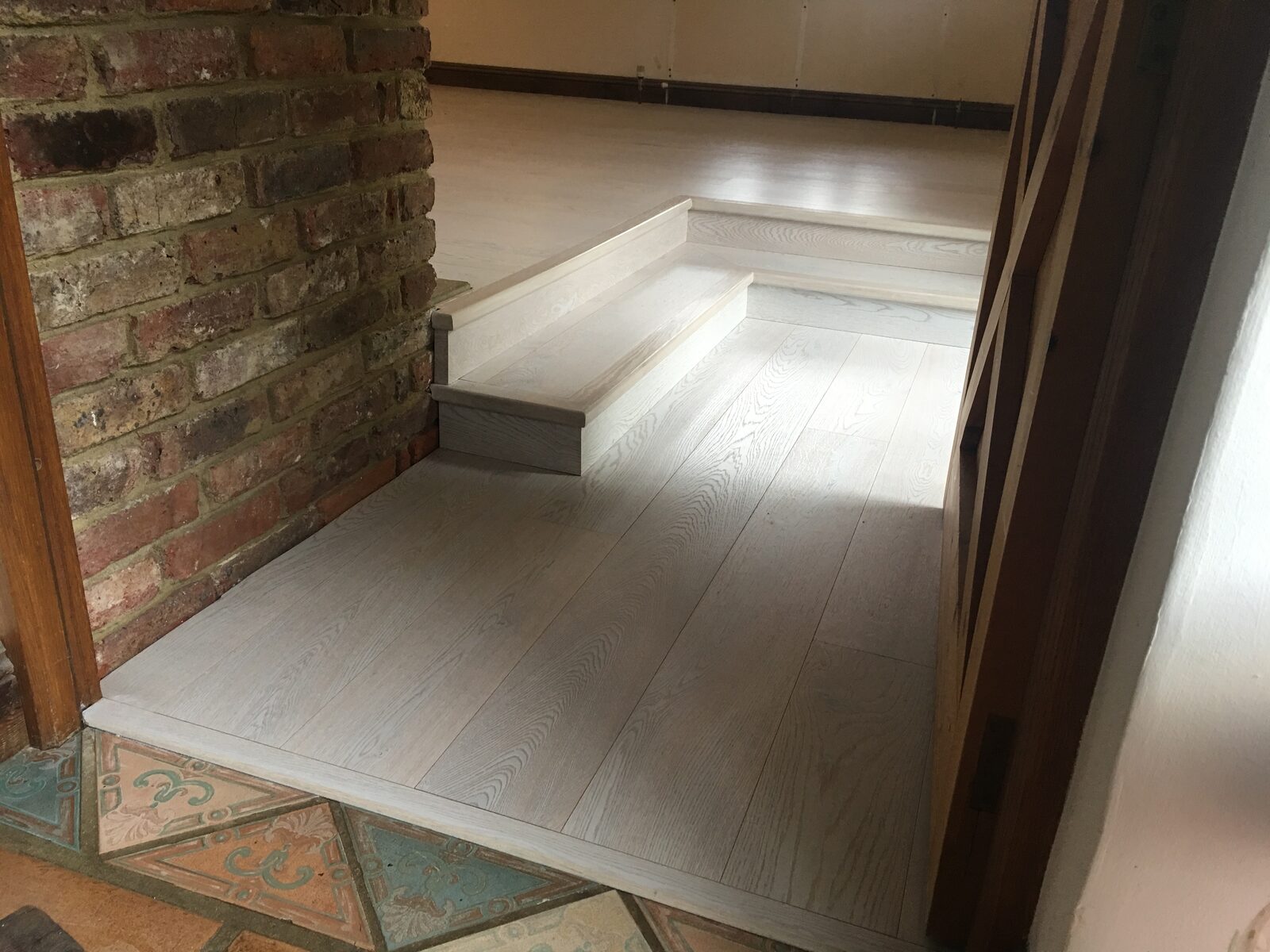 Prime-grade whitewashed engineered oak plank flooring in a Dial Post home