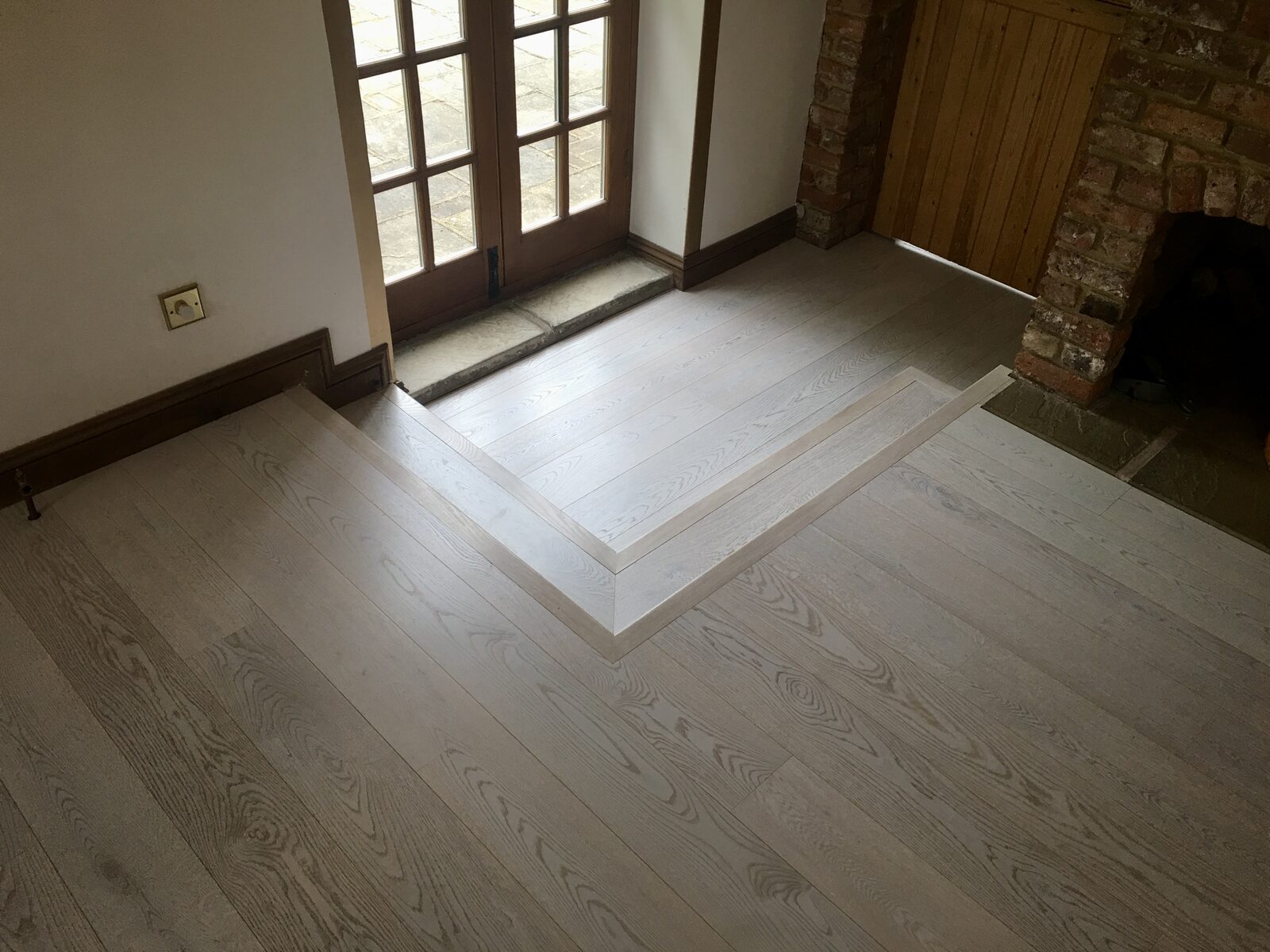 Prime-grade whitewashed engineered oak plank flooring in Chichester