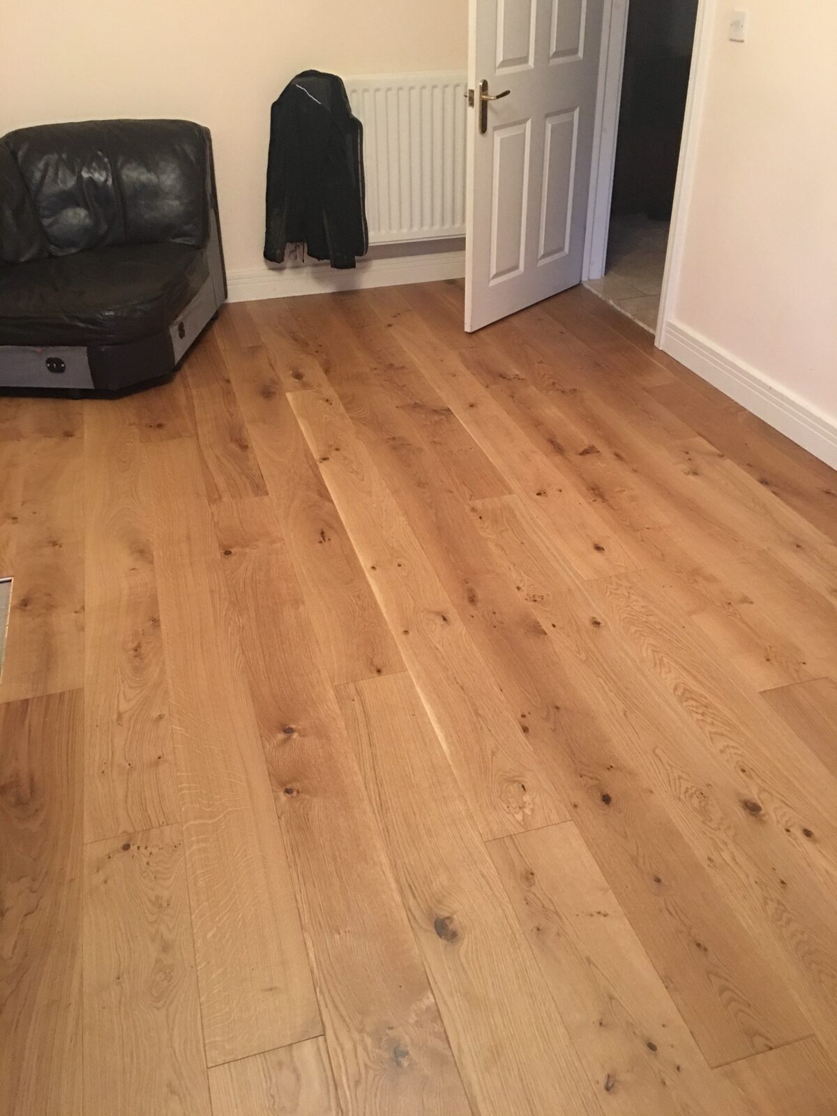 Rustic engineered oak plank flooring, of the kind we lay in Goodwood homes