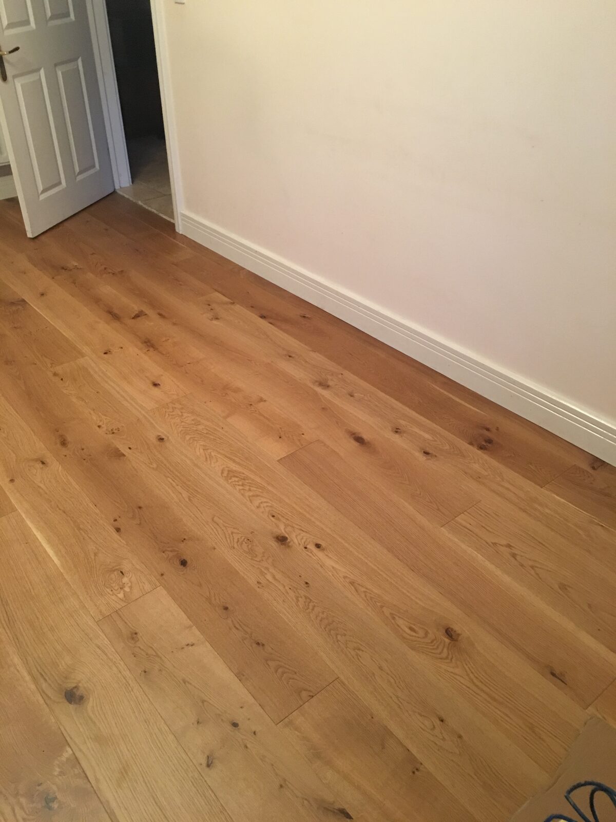 Rustic engineered oak plank flooring, of the kind we lay in Midhurst homes