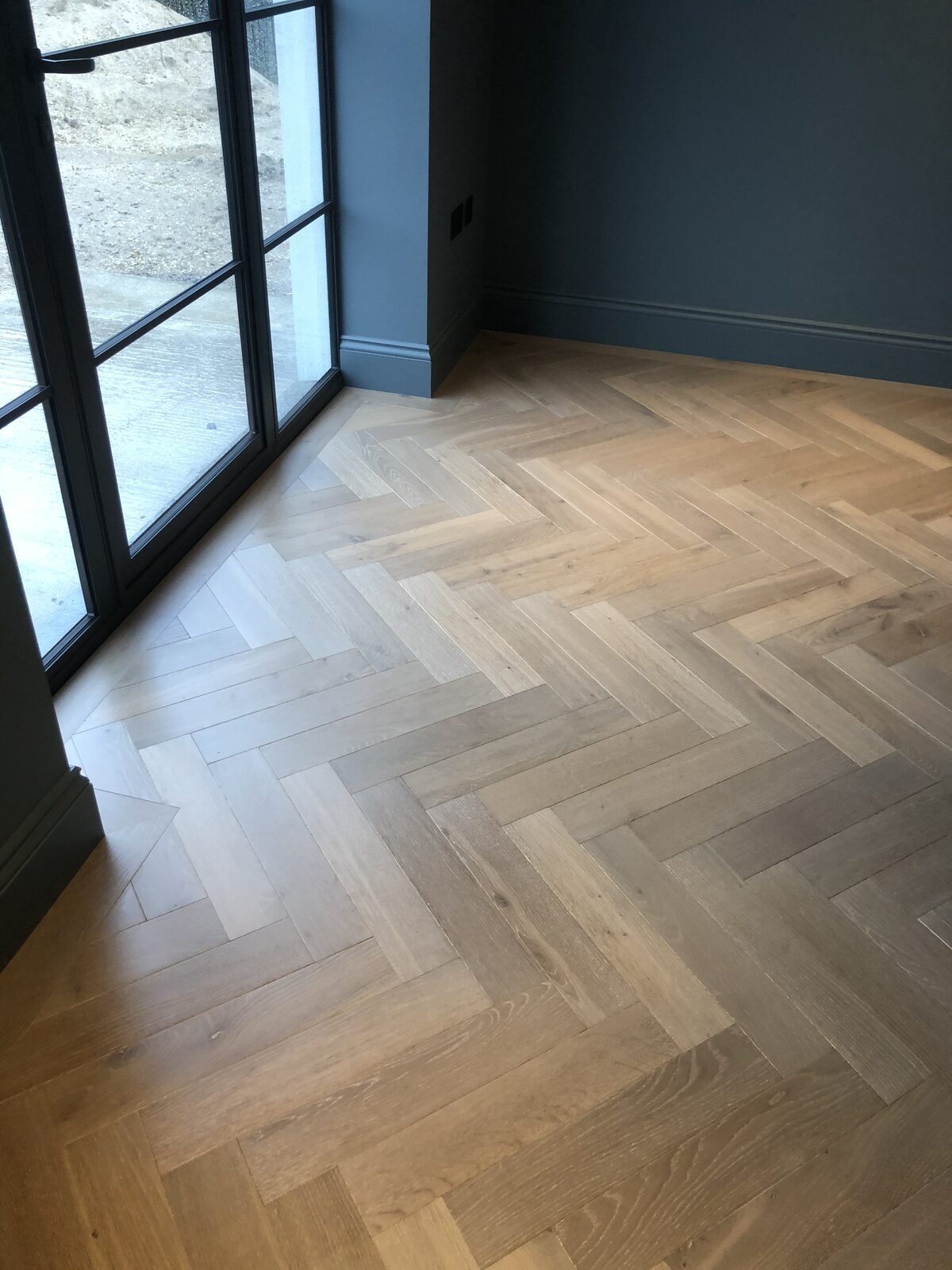 Engineered herringbone parquet, of the kind we lay in Petersfield homes