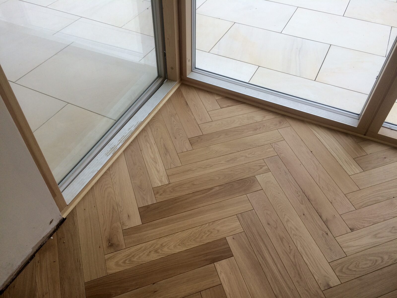 Engineered herringbone parquet in a Liphook home