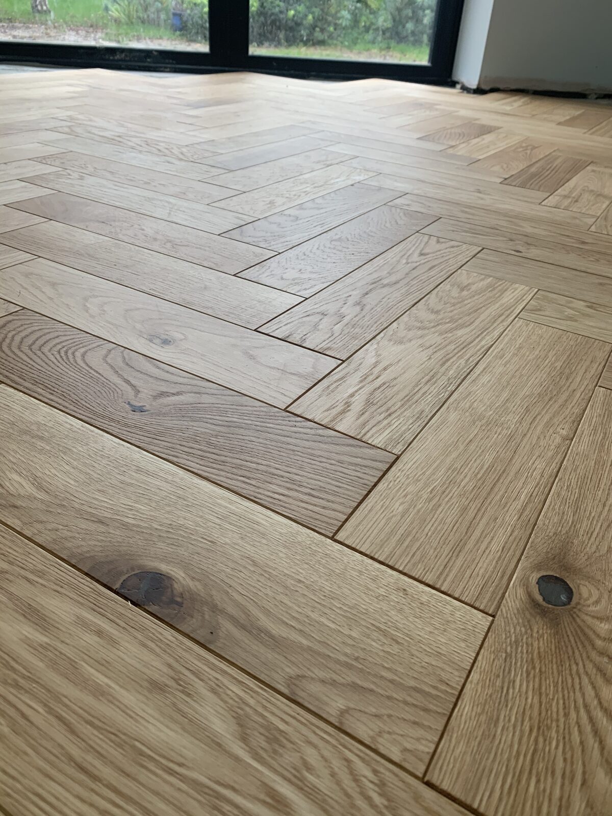 Engineered herringbone parquet, of the kind we lay in Steyning homes