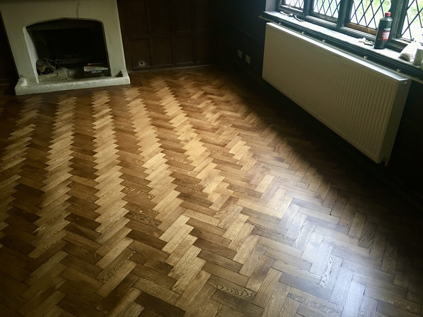 Restored oak herringbone parquet in a Chiddingfold home