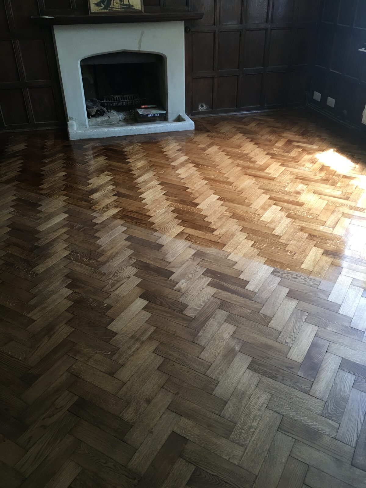 Restored oak herringbone parquet, of the kind we lay in Bosham homes
