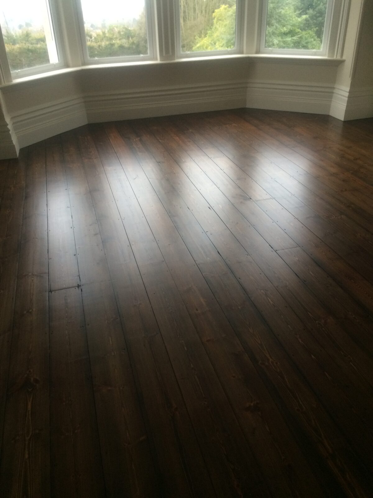 Restored pine floorboards, of the kind we lay in Arundel homes