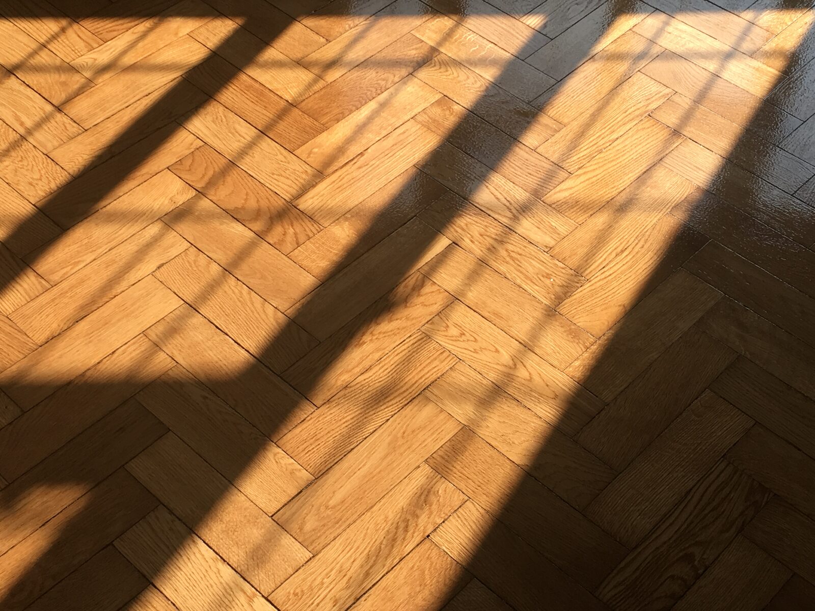 Restored oak herringbone parquet in a Loxwood home