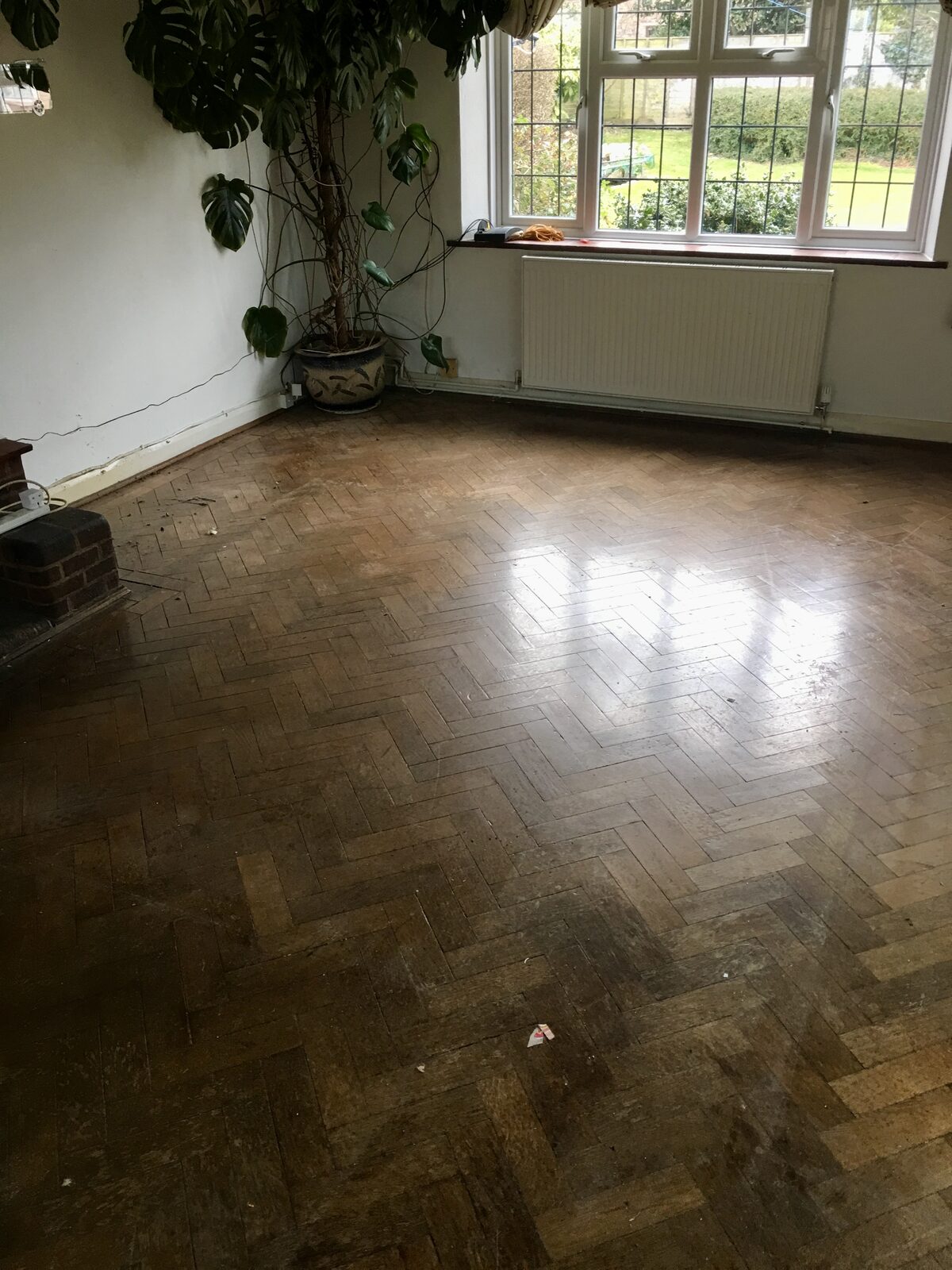 Restored oak herringbone parquet, of the kind we lay in Goodwood homes