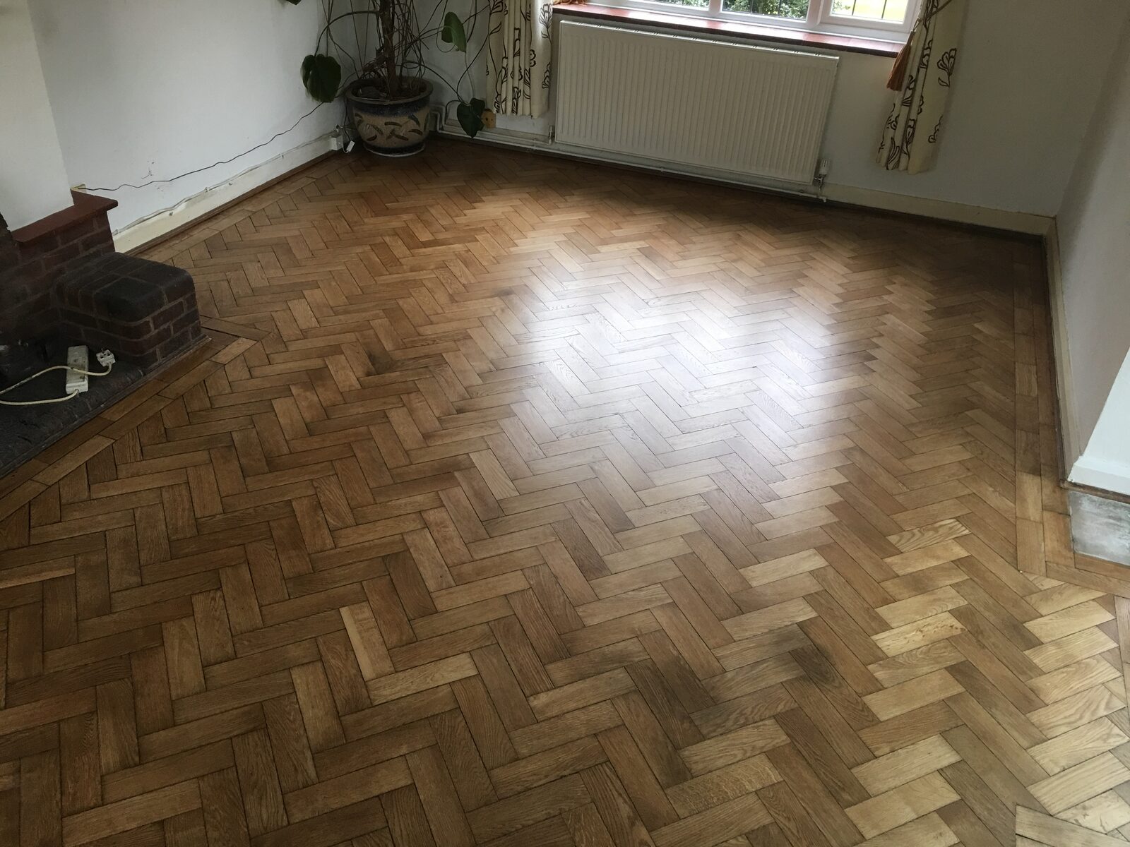 Restored oak herringbone parquet in a Pulborough & Storrington home