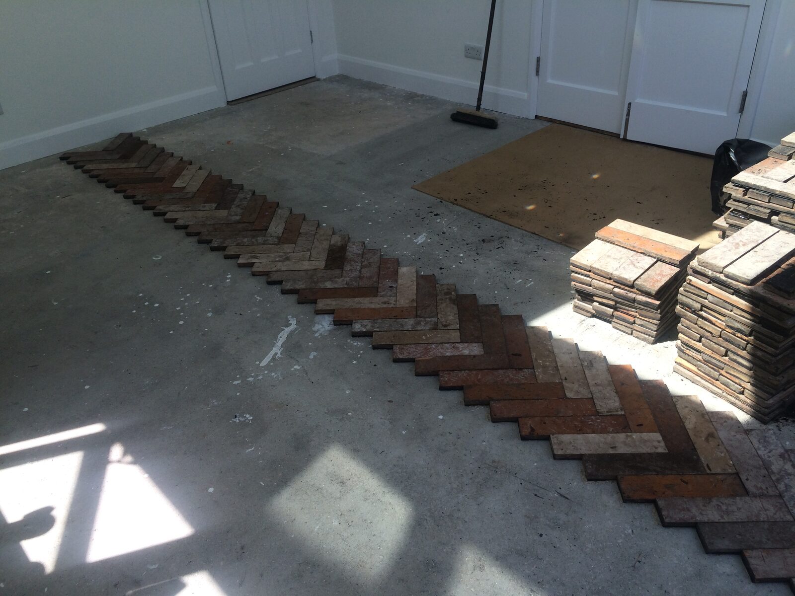 Reclaimed pine herringbone parquet laid by Forrestal Flooring