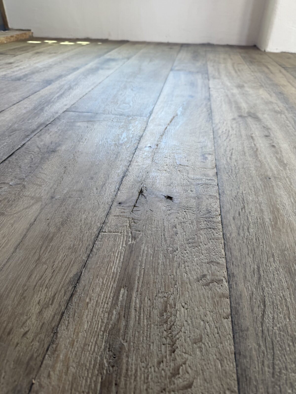 Rustic engineered plank flooring, of the kind we lay in Chichester homes