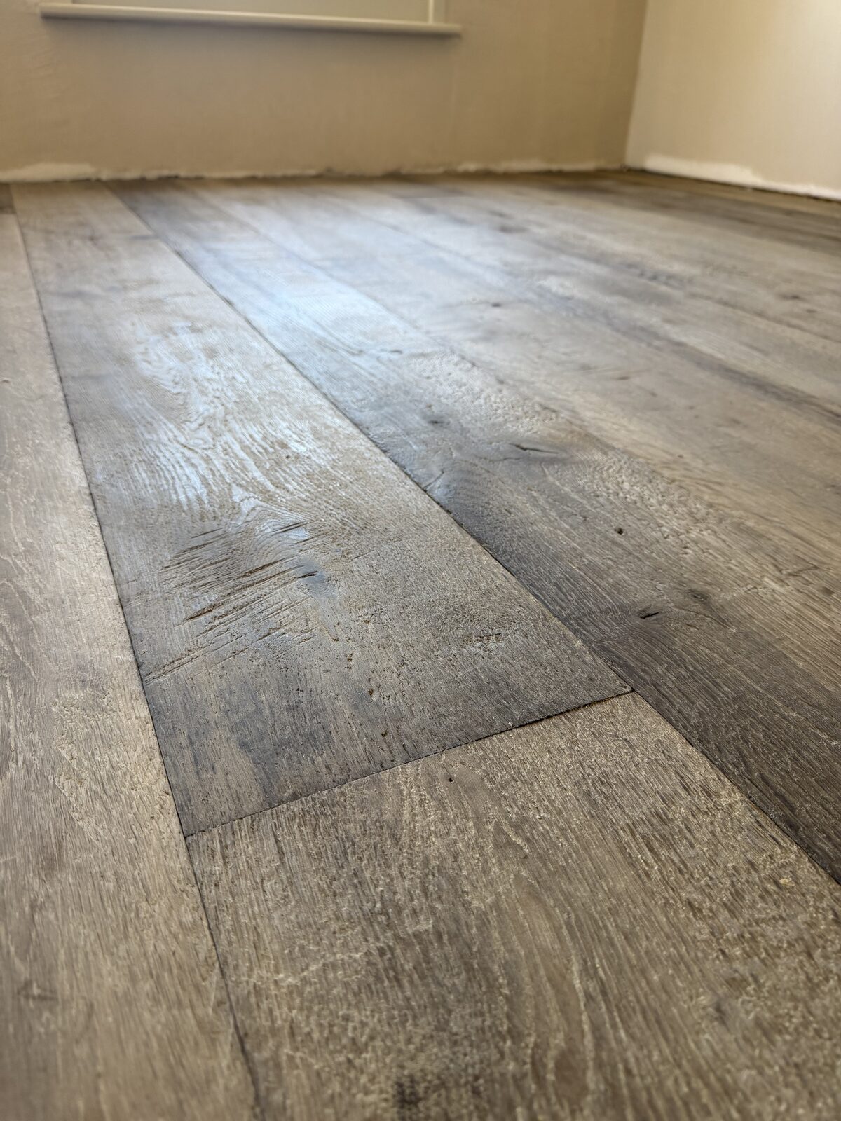 Rustic engineered plank flooring, of the kind we lay in Midhurst homes