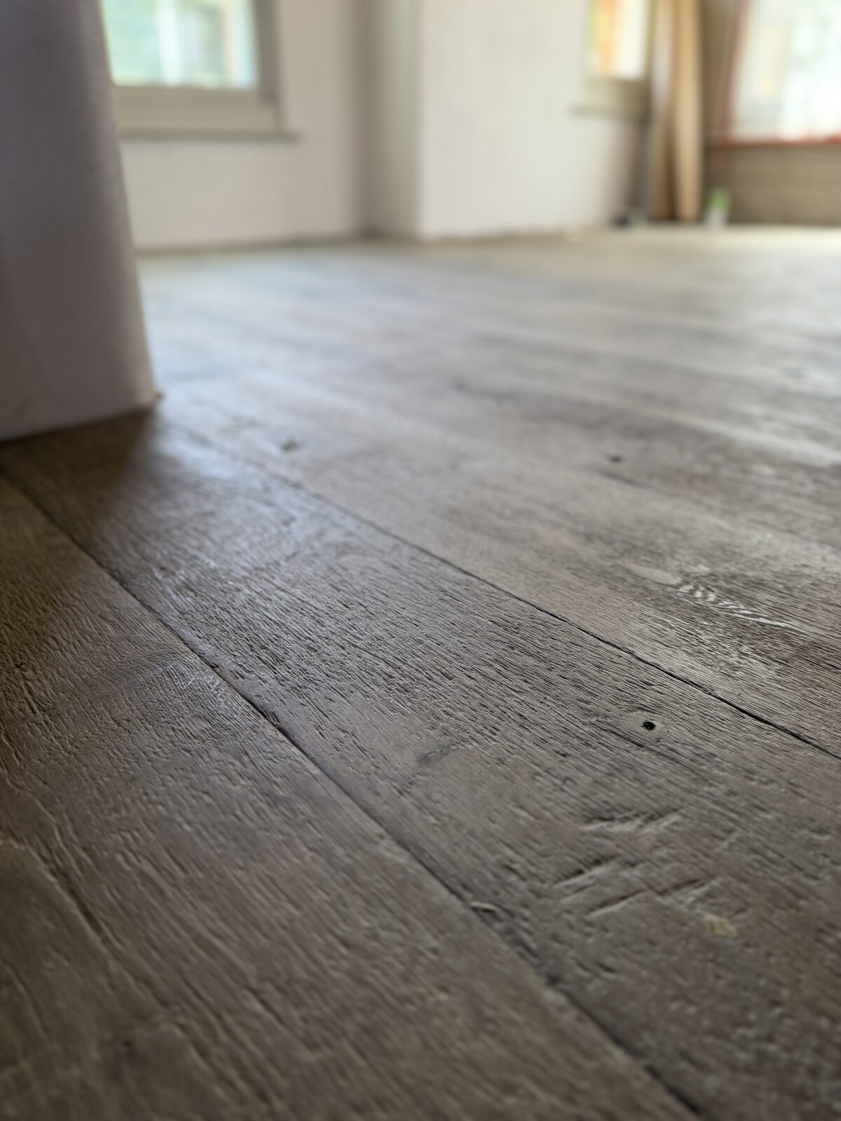 Rustic engineered plank flooring, of the kind we lay in Chichester Harbour homes