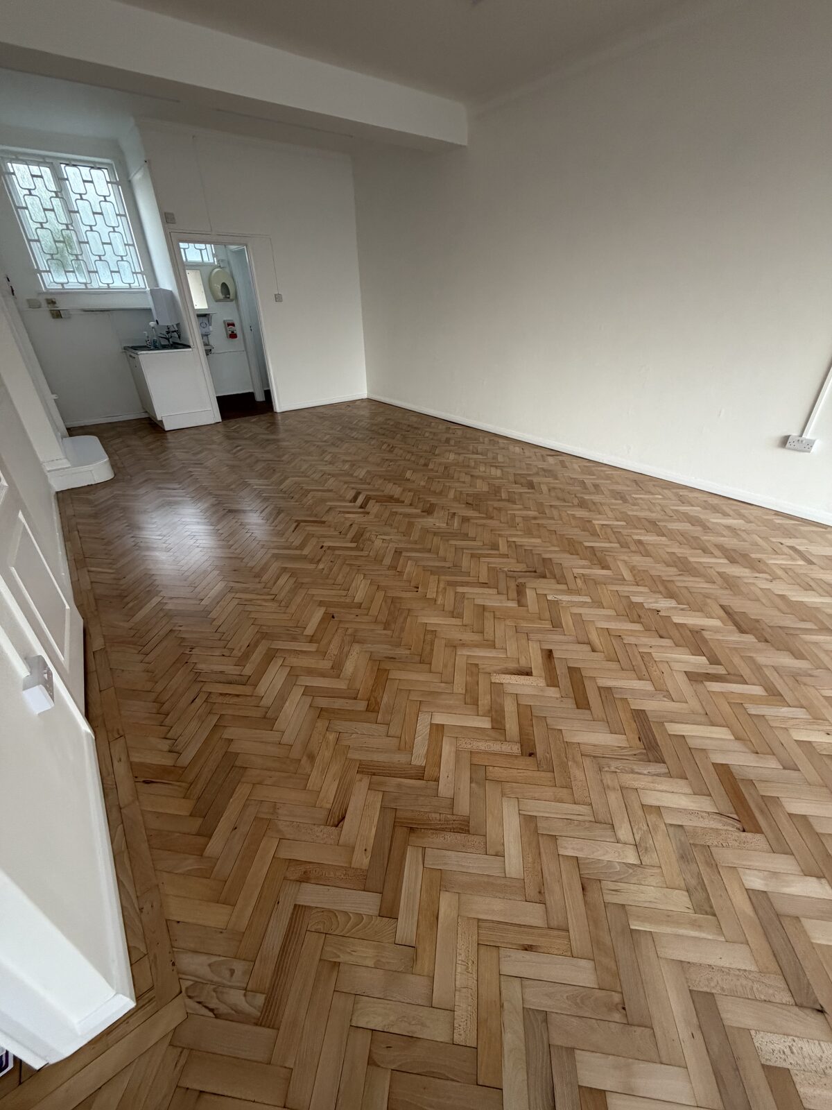 Pale oak herringbone mid-restoration